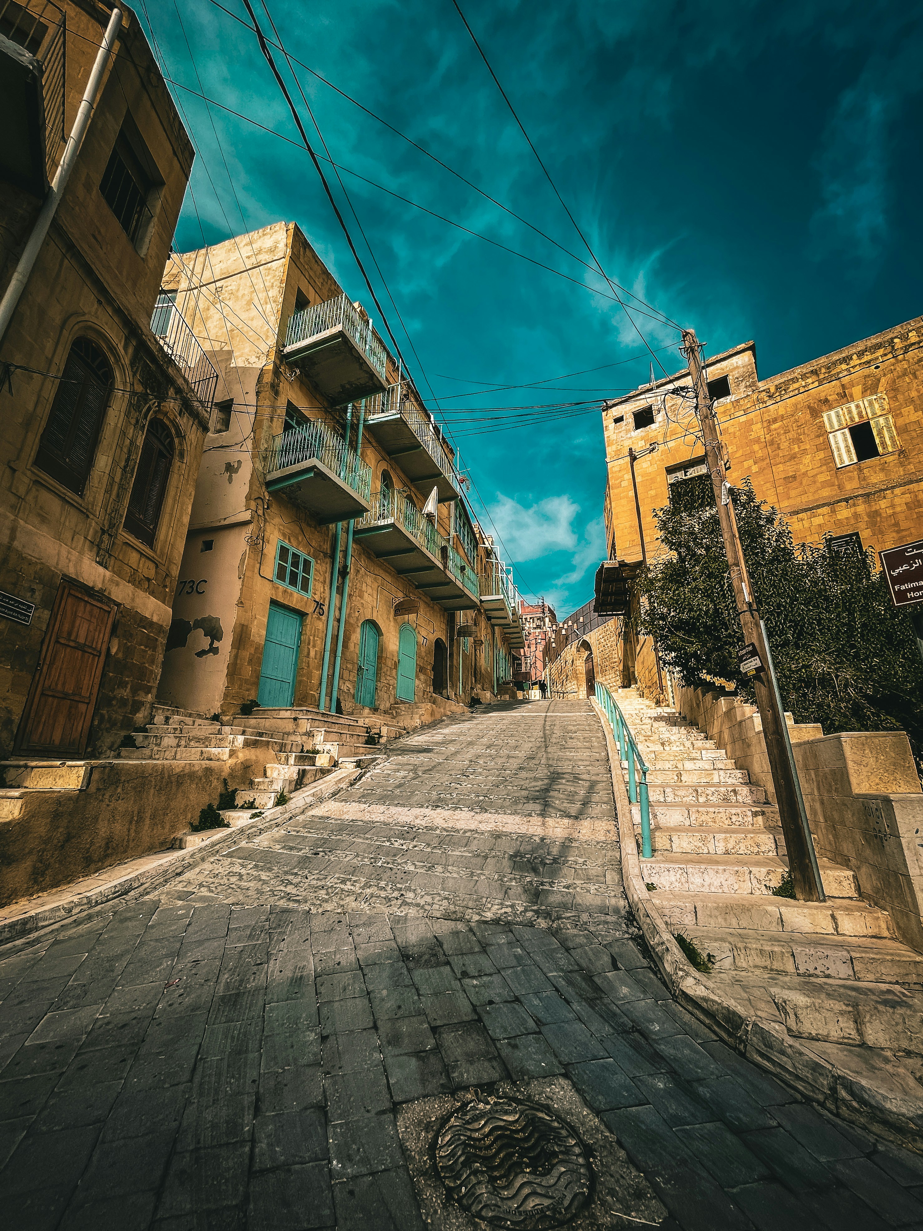 an empty street with a few buildings on both sides