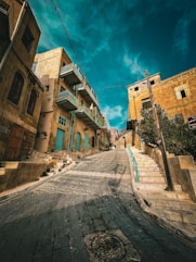 an empty street with a few buildings on both sides