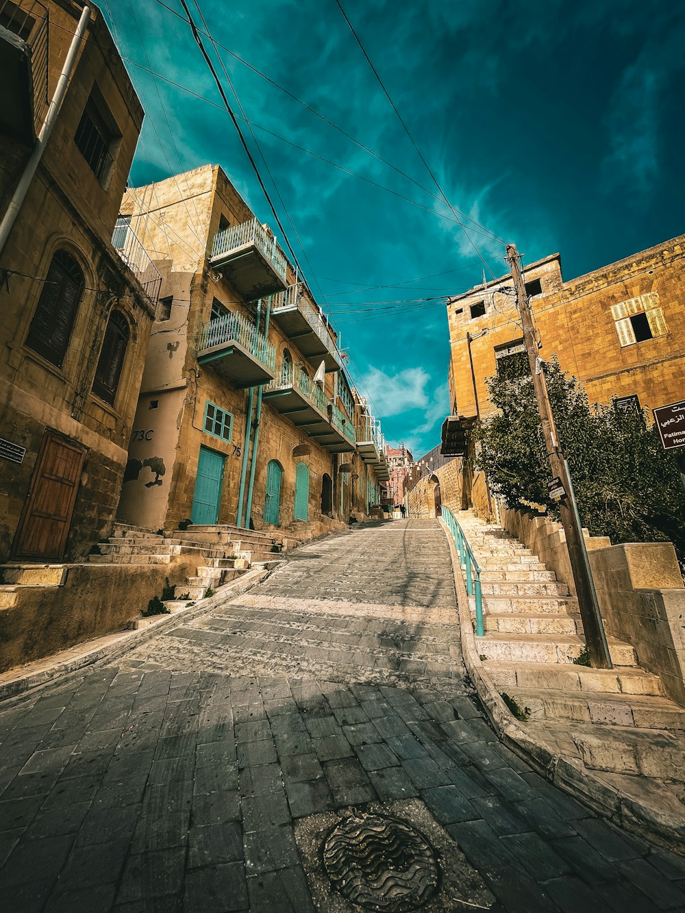 an empty street with a few buildings on both sides