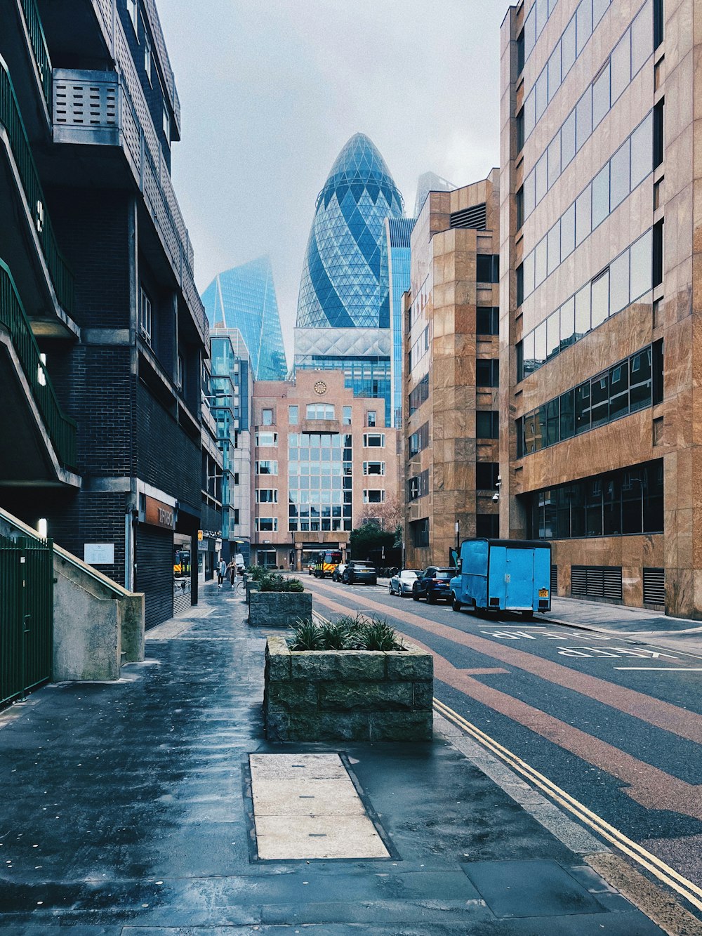 a city street lined with tall buildings next to each other