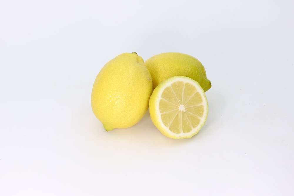 a couple of lemons sitting next to each other