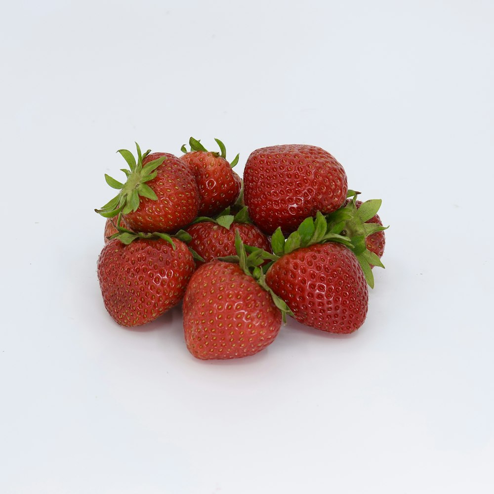 a group of strawberries sitting on top of each other