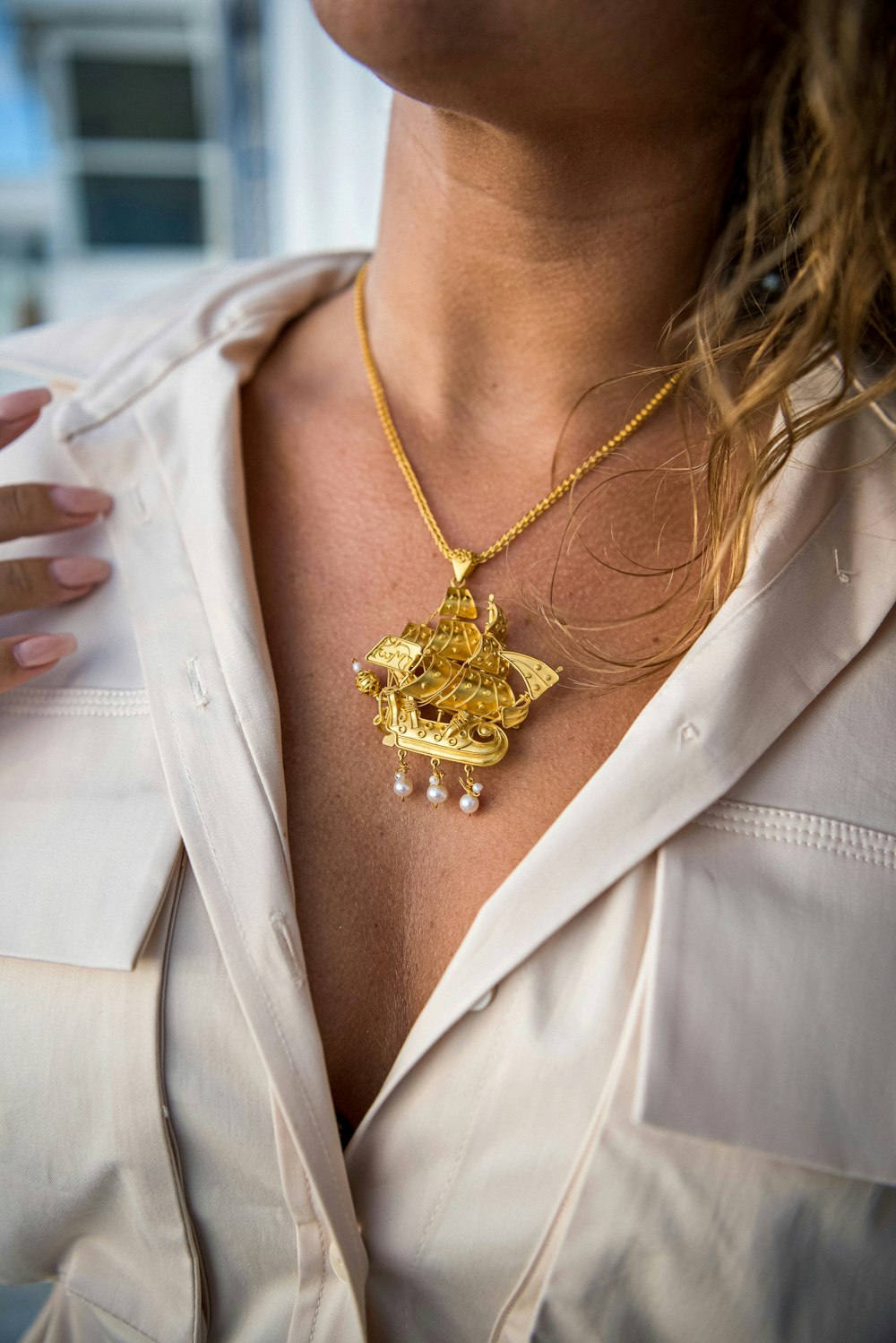 a close up of a person wearing a necklace