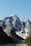 a mountain range with a lake in the foreground