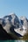 a mountain range with a lake in the foreground