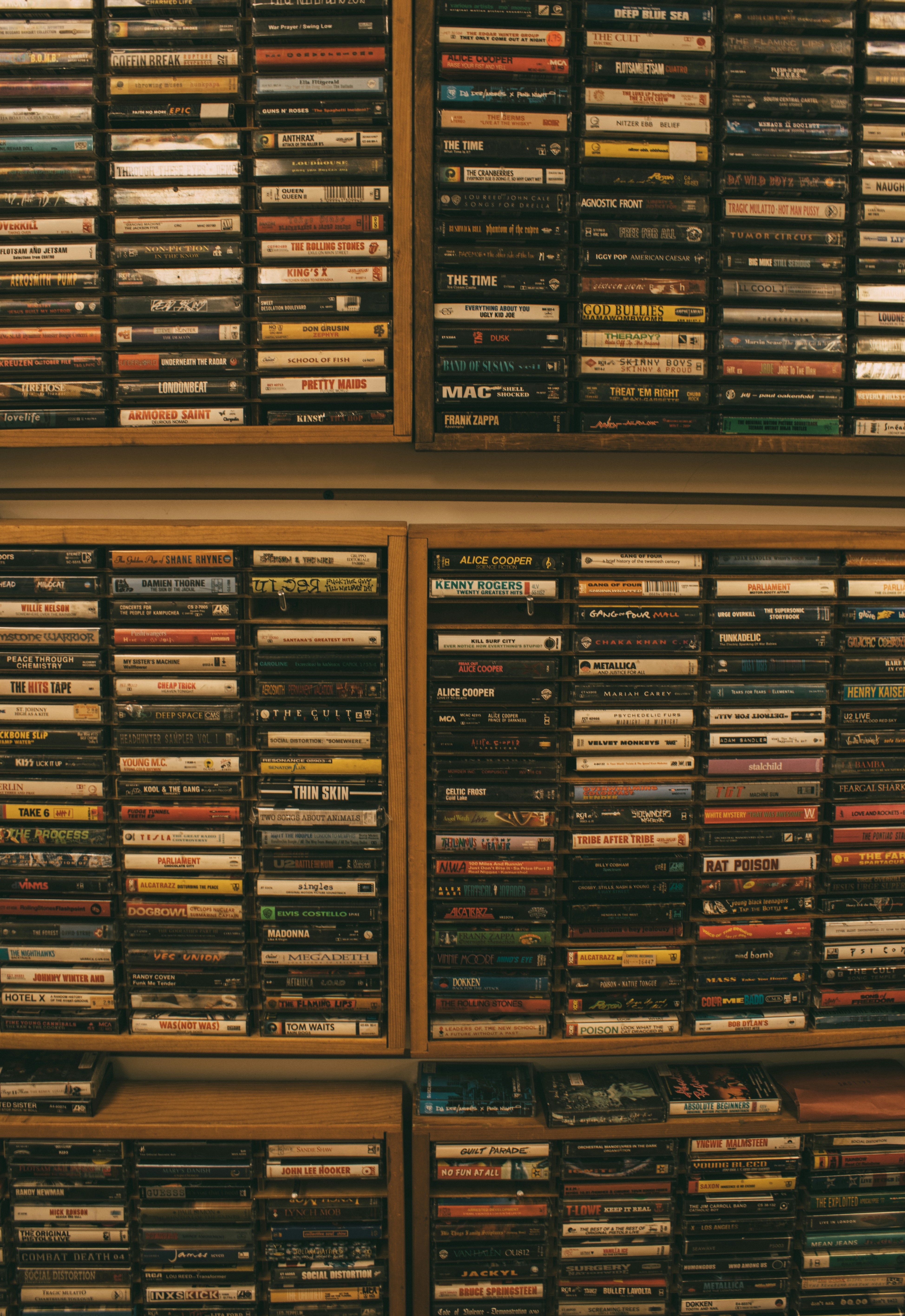 a wall full of dvd's in a room