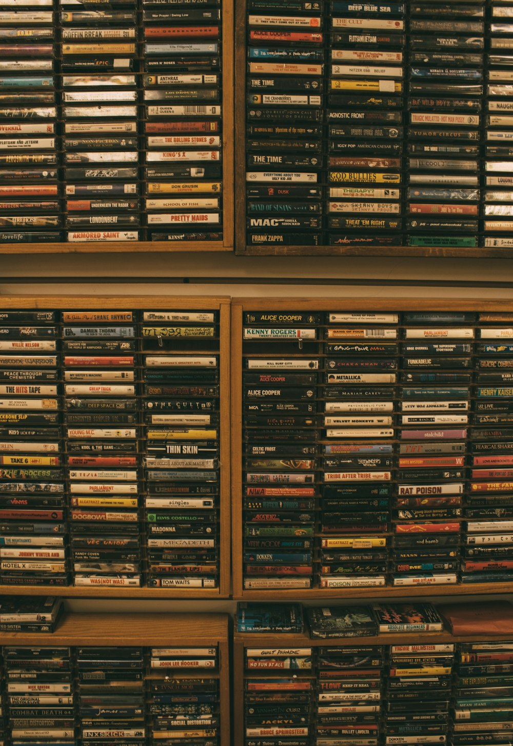 a wall full of dvd's in a room