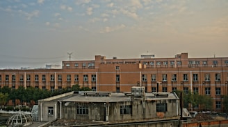 a building with a lot of windows and a sky background