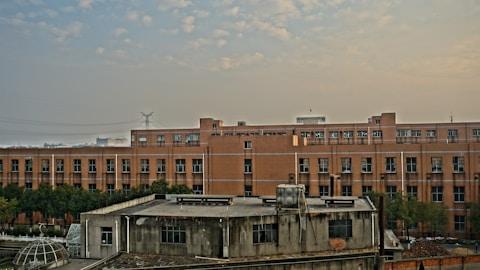 a building with a lot of windows and a sky background