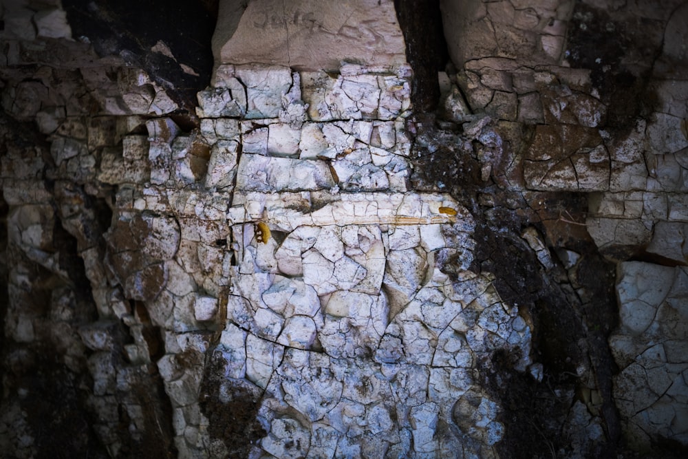 a stone wall with a cross painted on it