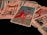 A collection of tarot cards is spread out, featuring various illustrated scenes and symbols. Dominant cards include a figure on horseback holding a staff, and another card shows a structure with four tall poles surrounding it.