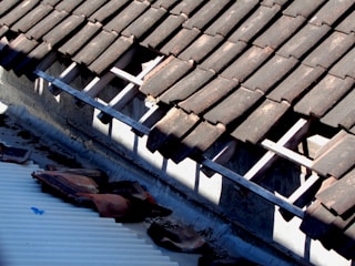 the roof of a building with a broken gutter