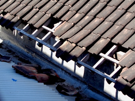 the roof of a building with a broken gutter