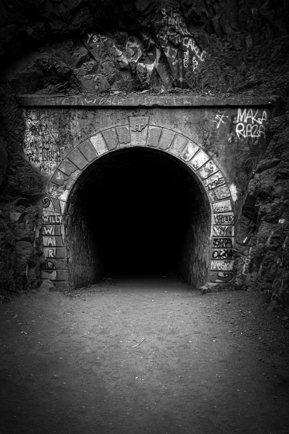 a black and white photo of a tunnel