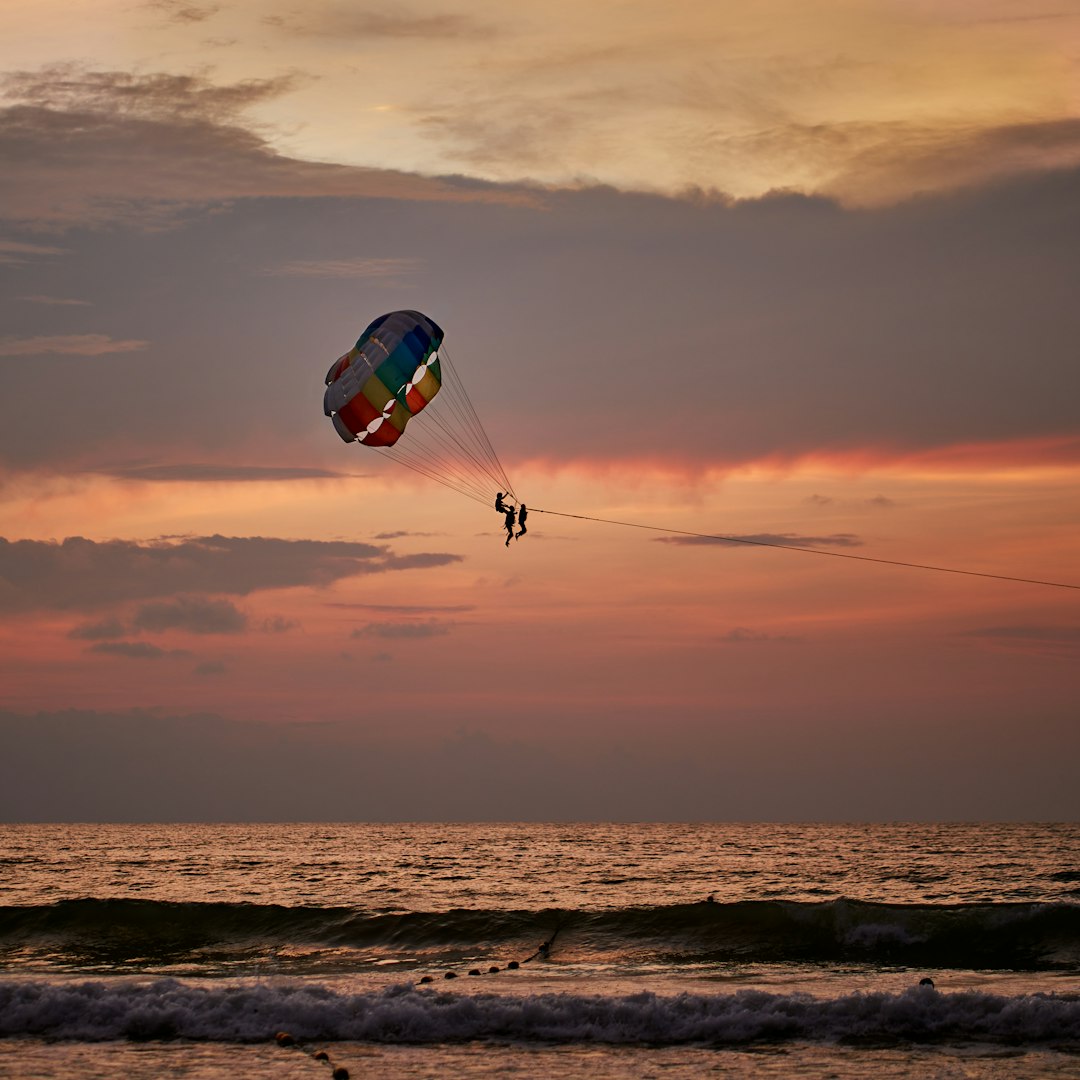 Parasailing over crystal clear blue waters in Goa