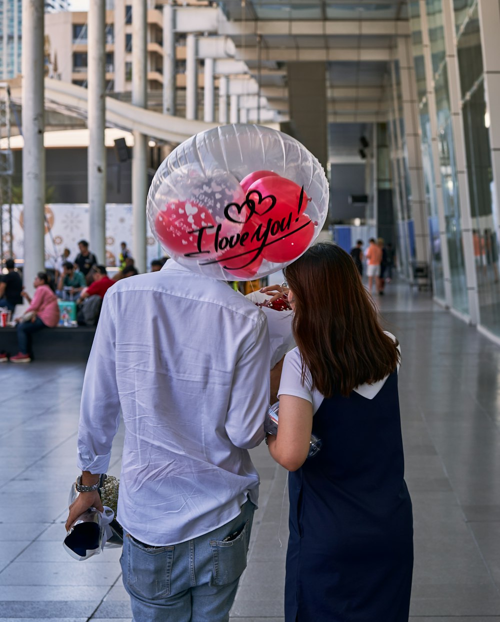 a man and a woman walking down a street