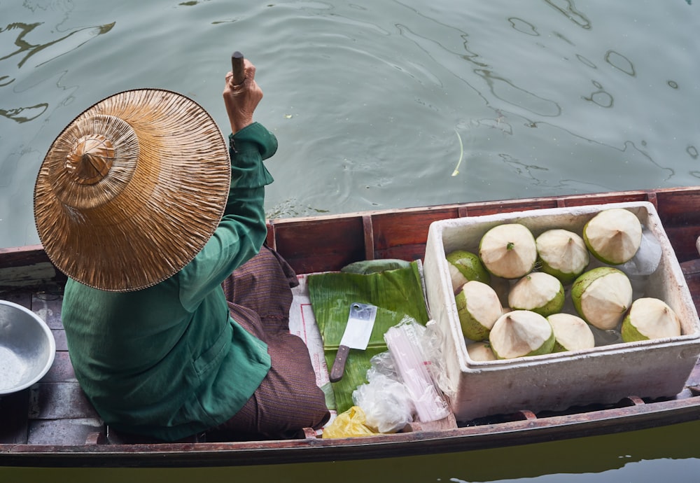 a person on a boat with some food