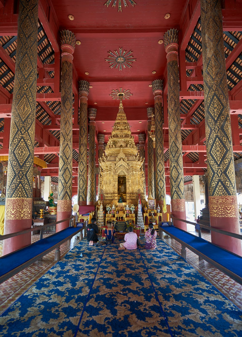 a group of people sitting on the floor of a building