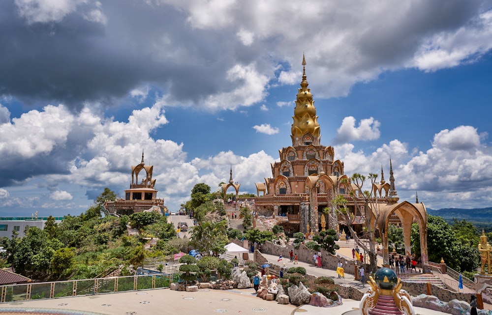 a large building with a golden spire on top of it