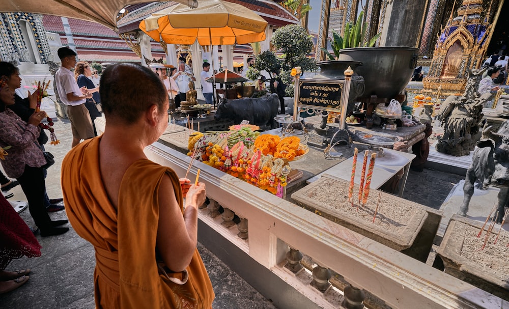 a person sitting at a table with food