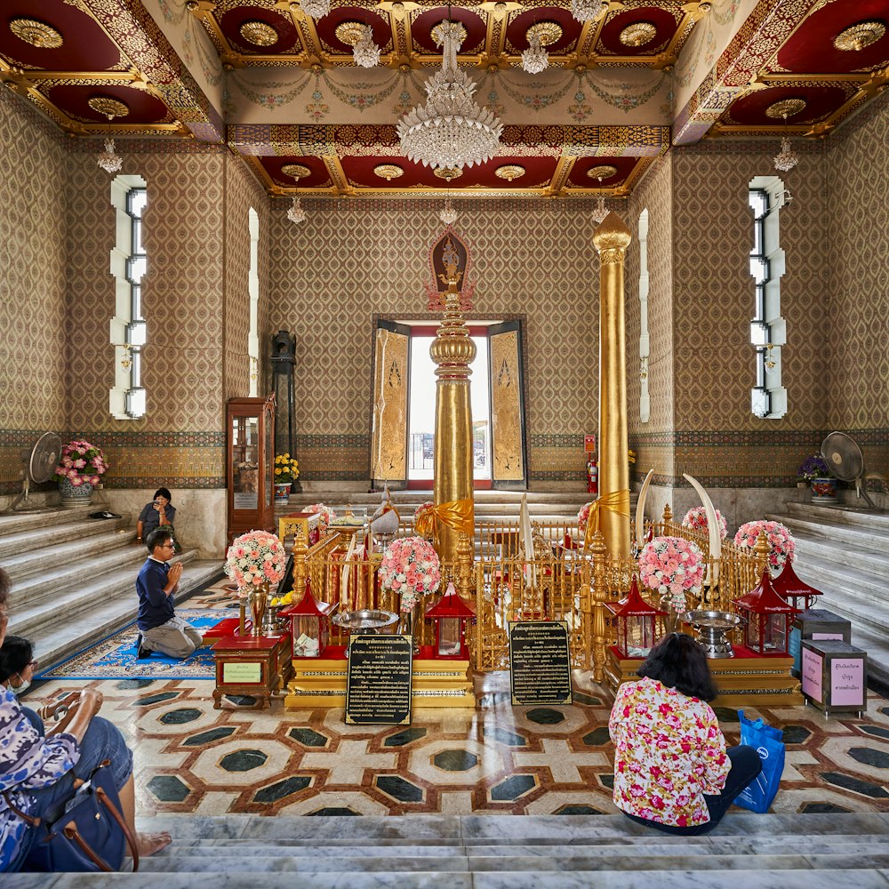 a group of people sitting on the floor in a room