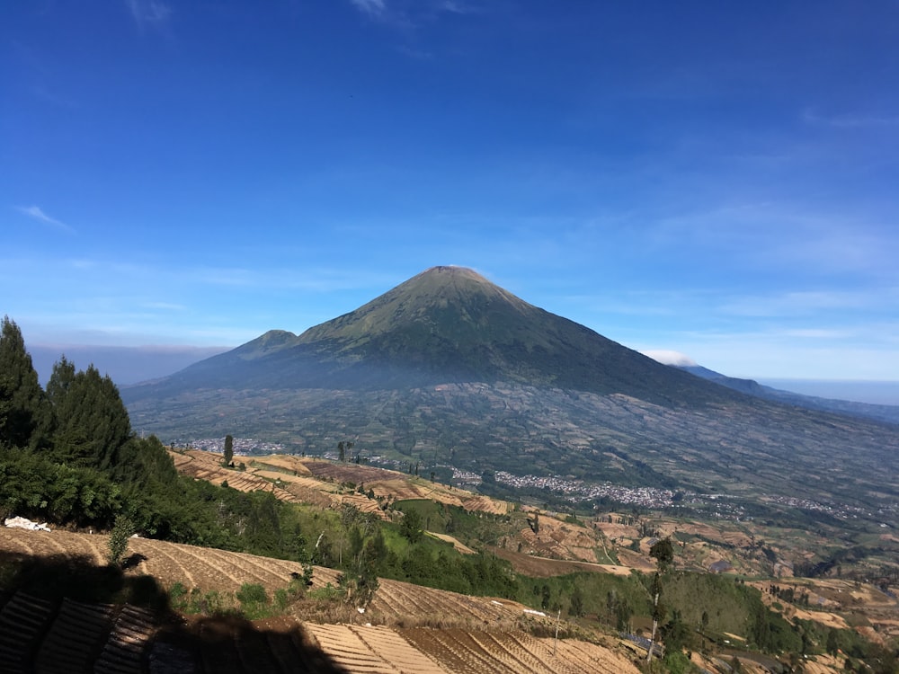 a view of a mountain with a clear blue sky