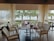 A beautifully set dining table with ocean views and fresh seafood dishes.