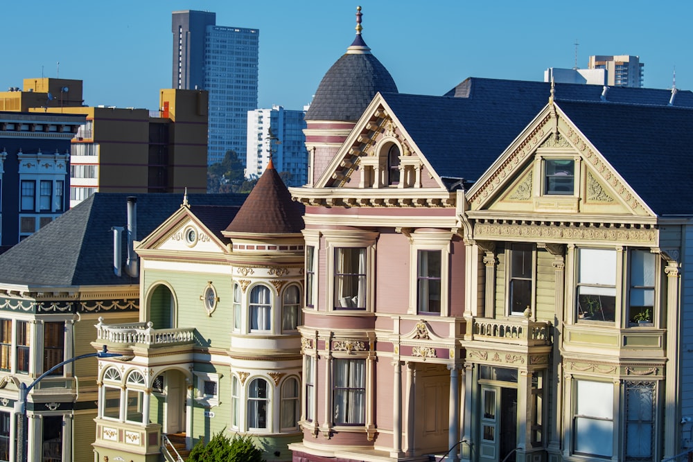 a row of victorian style houses in a city