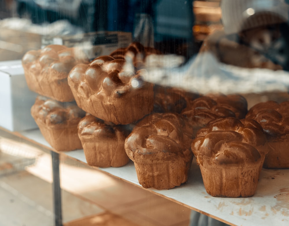 a bunch of cupcakes that are on a shelf