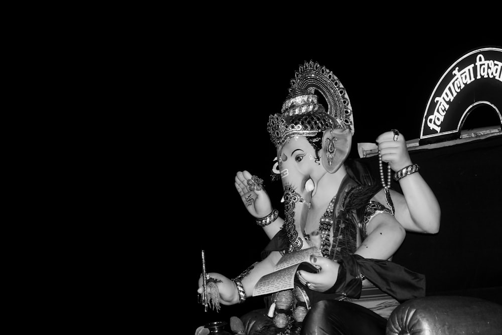 a black and white photo of an indian god