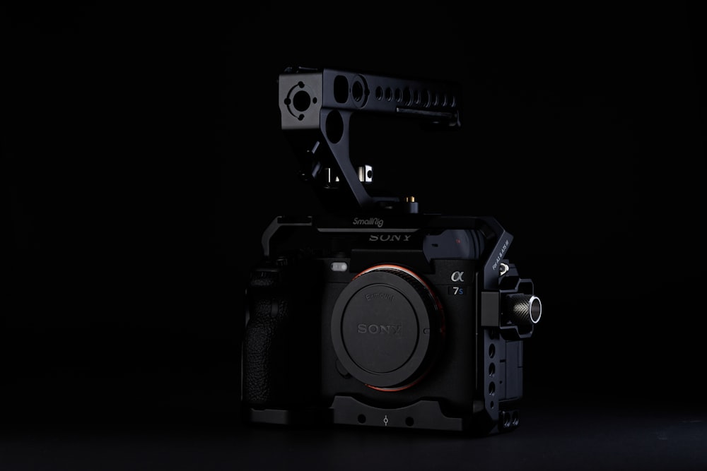 a black camera with a black background