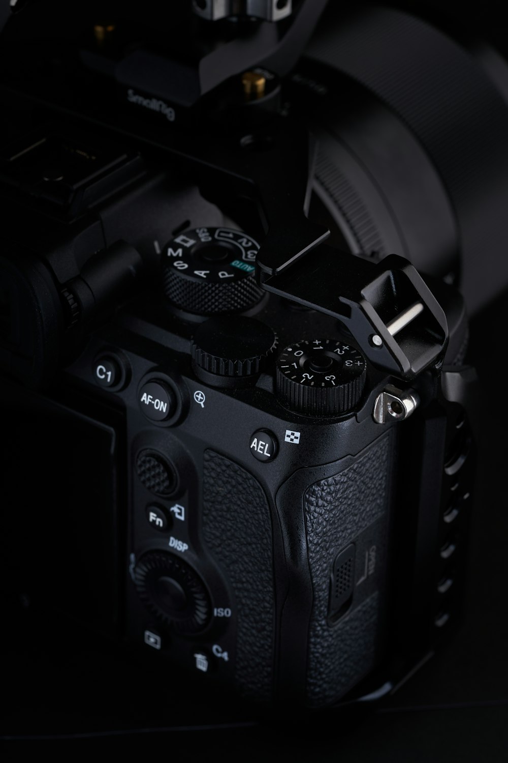 a close up of a camera on a black background