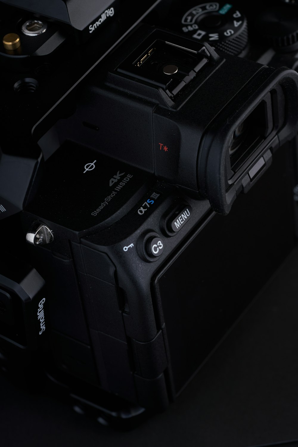 a close up of a camera on a black surface