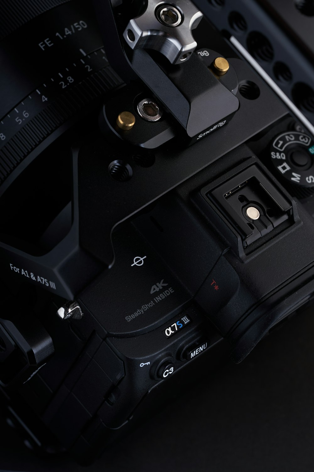 a close up of a camera with a black background