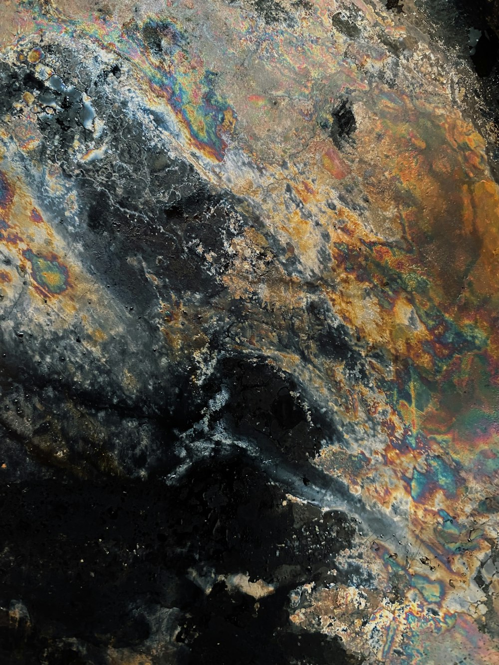 a close up of a rock with a lot of paint on it