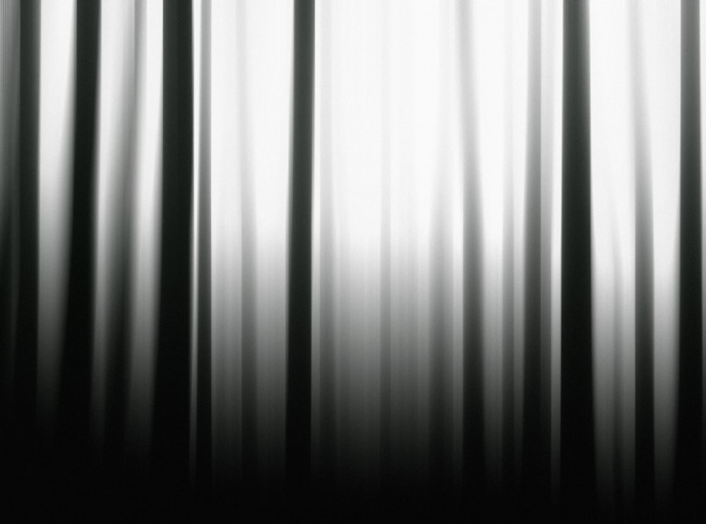 a black and white photo of a curtain