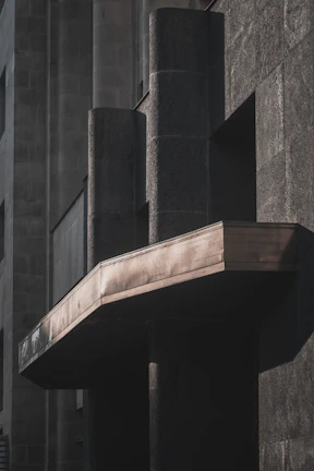 Architectural detail highlighting interplay of light and shadow on textured surfaces.