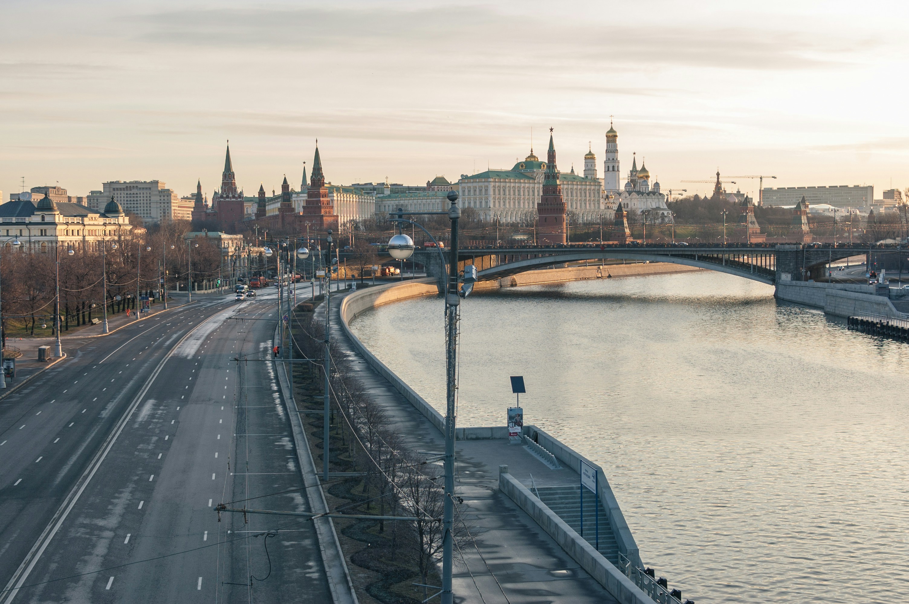 a view of a bridge over a river with a city in the background