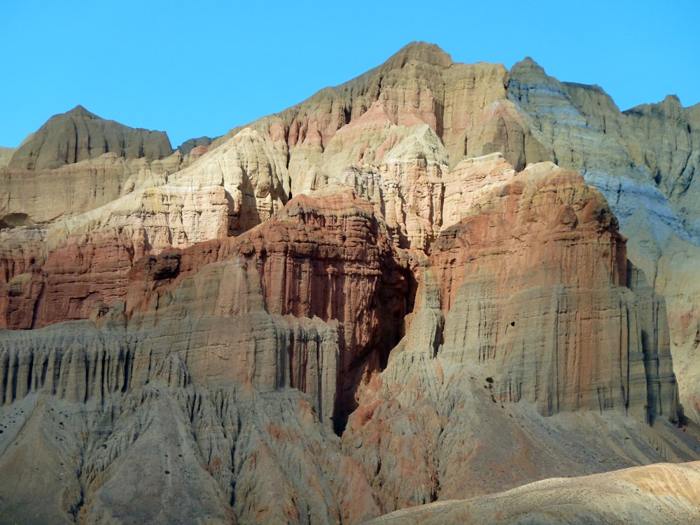 a group of mountains with a blue sky in the background