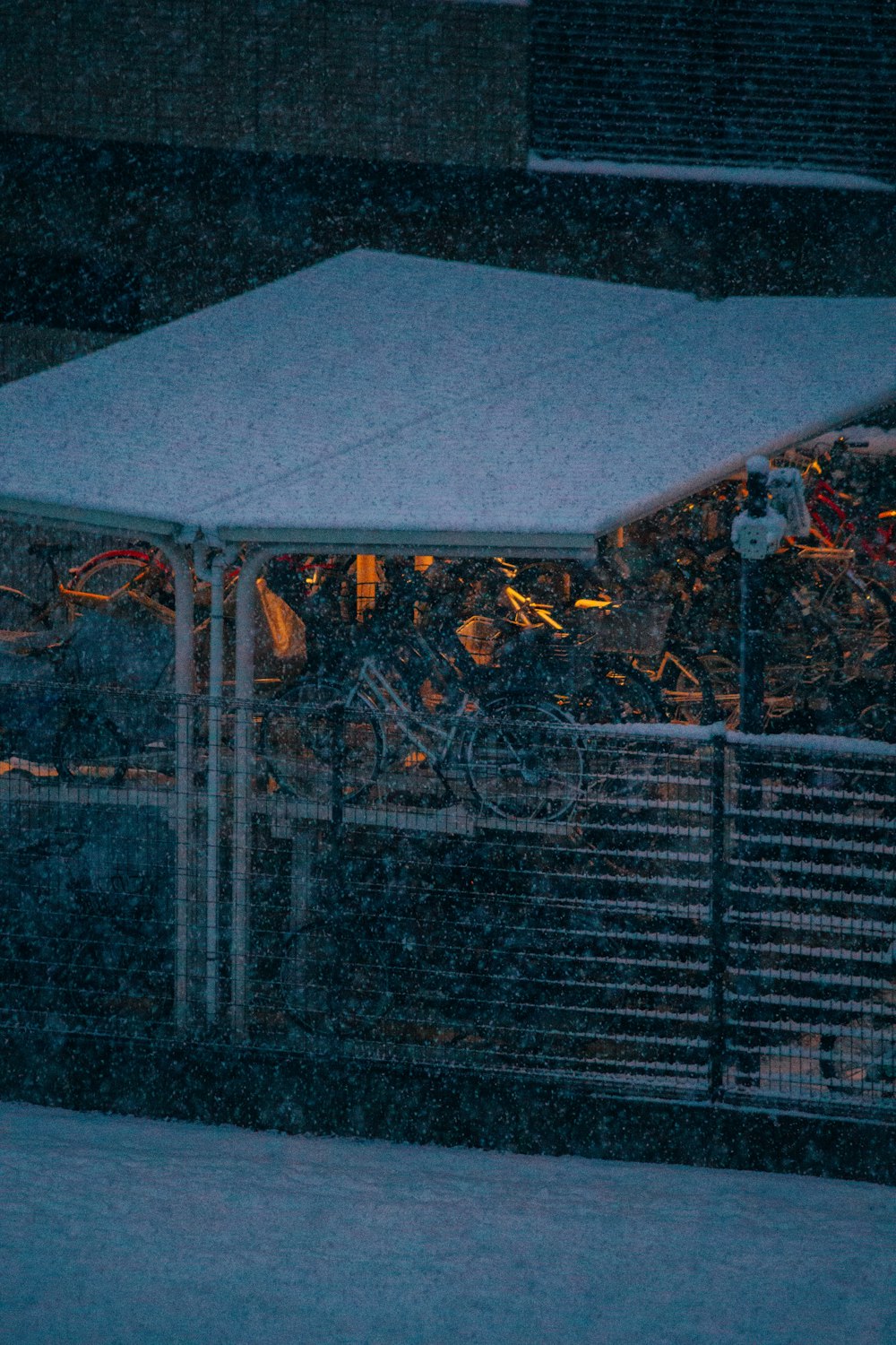 a bunch of bikes are parked in the snow
