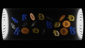 a close up of a cell phone with bitcoins on it