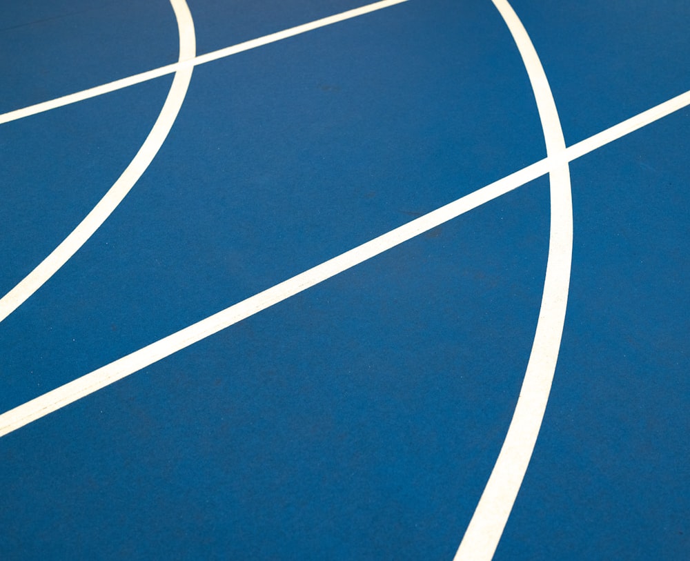 a tennis court with a blue court and white lines