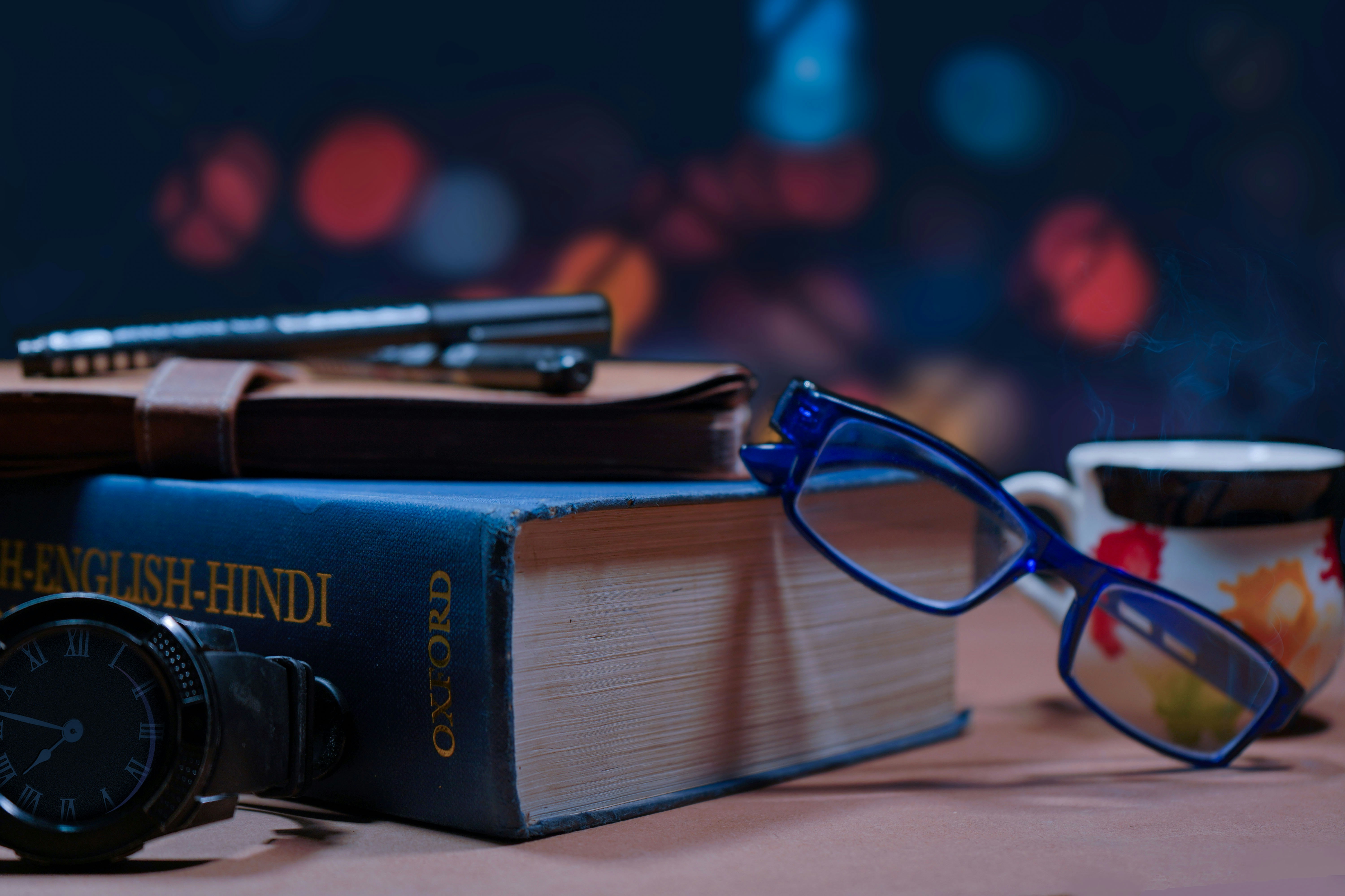 a pair of glasses sitting on top of a book