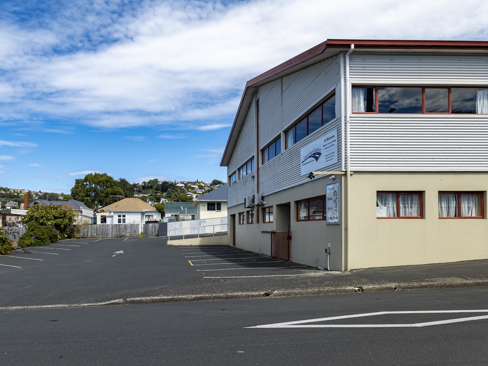 an empty parking lot next to a building