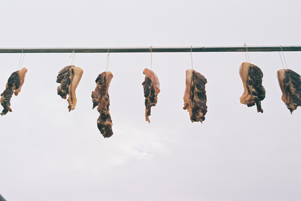 a line of food hanging from a clothes line
