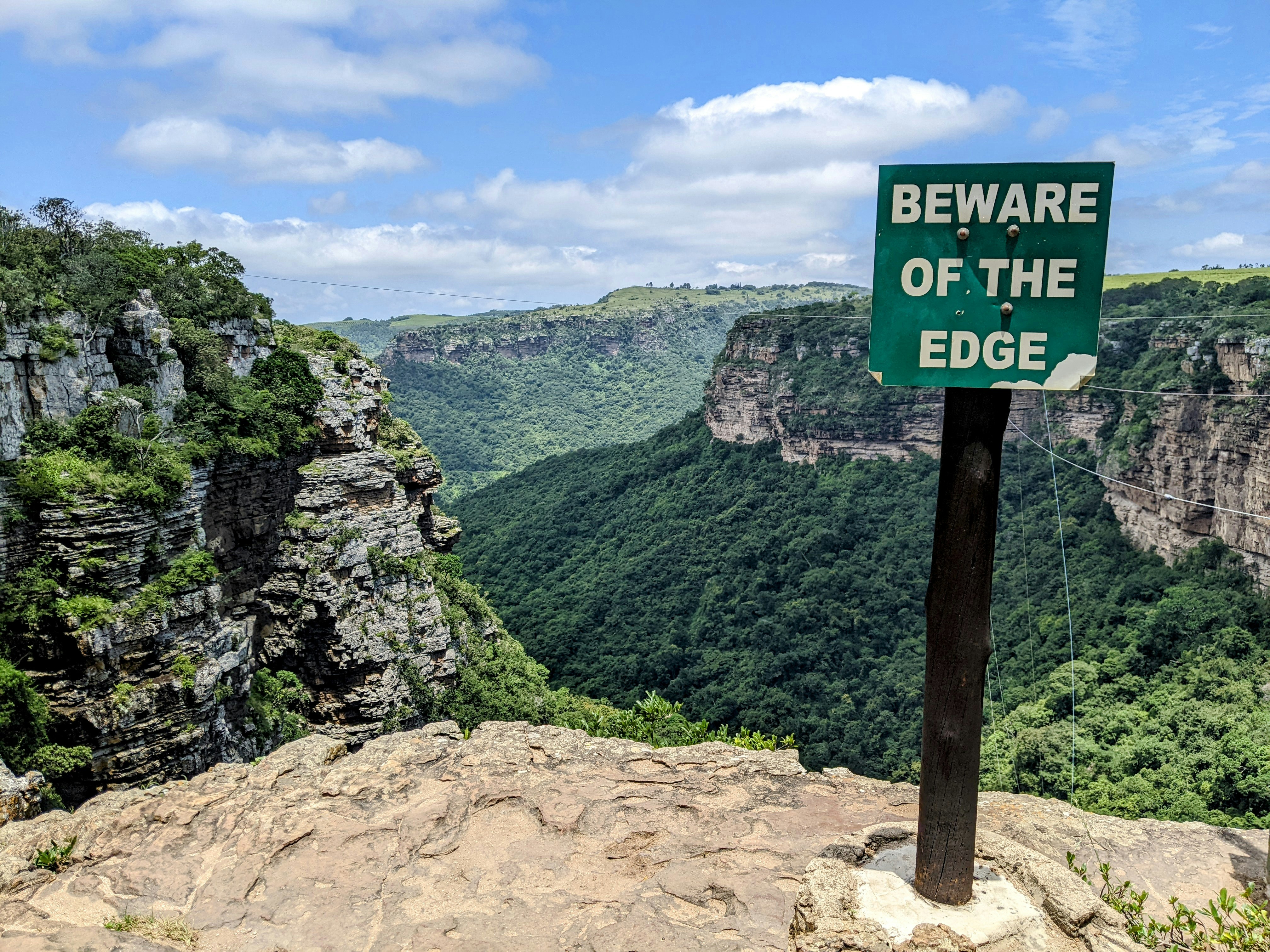 a sign that is on top of a mountain