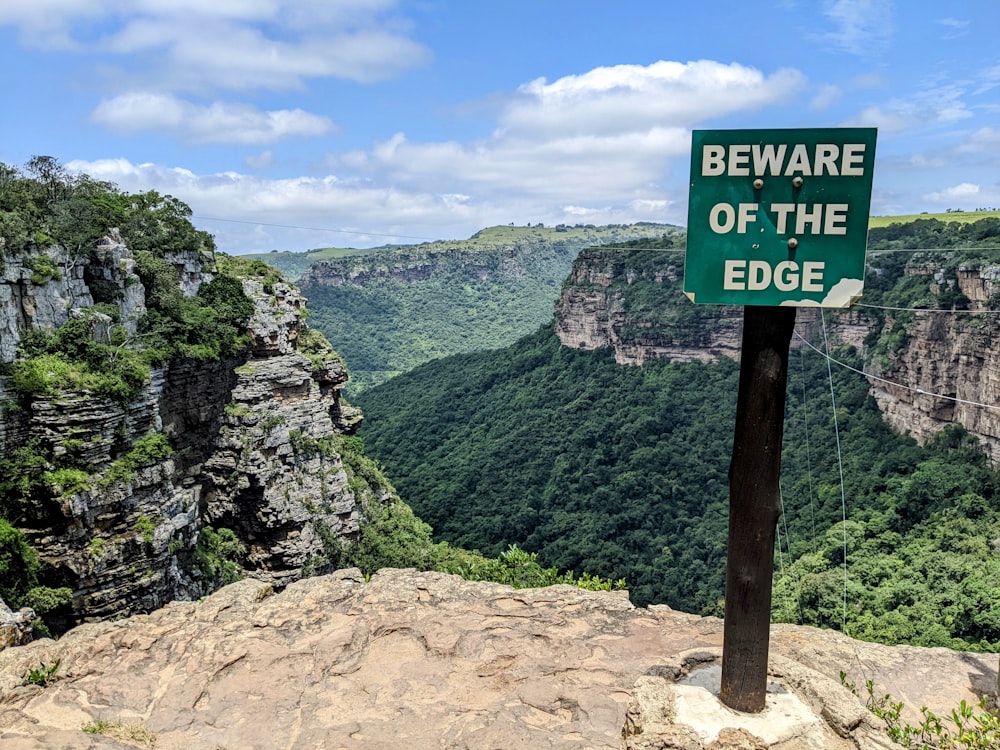 a sign that is on top of a mountain