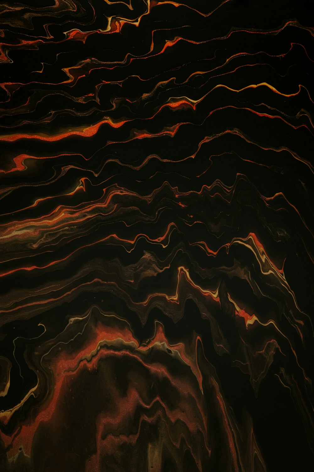 a black background with red and orange swirls