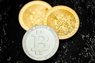 a bitcoin coin sitting on top of a table