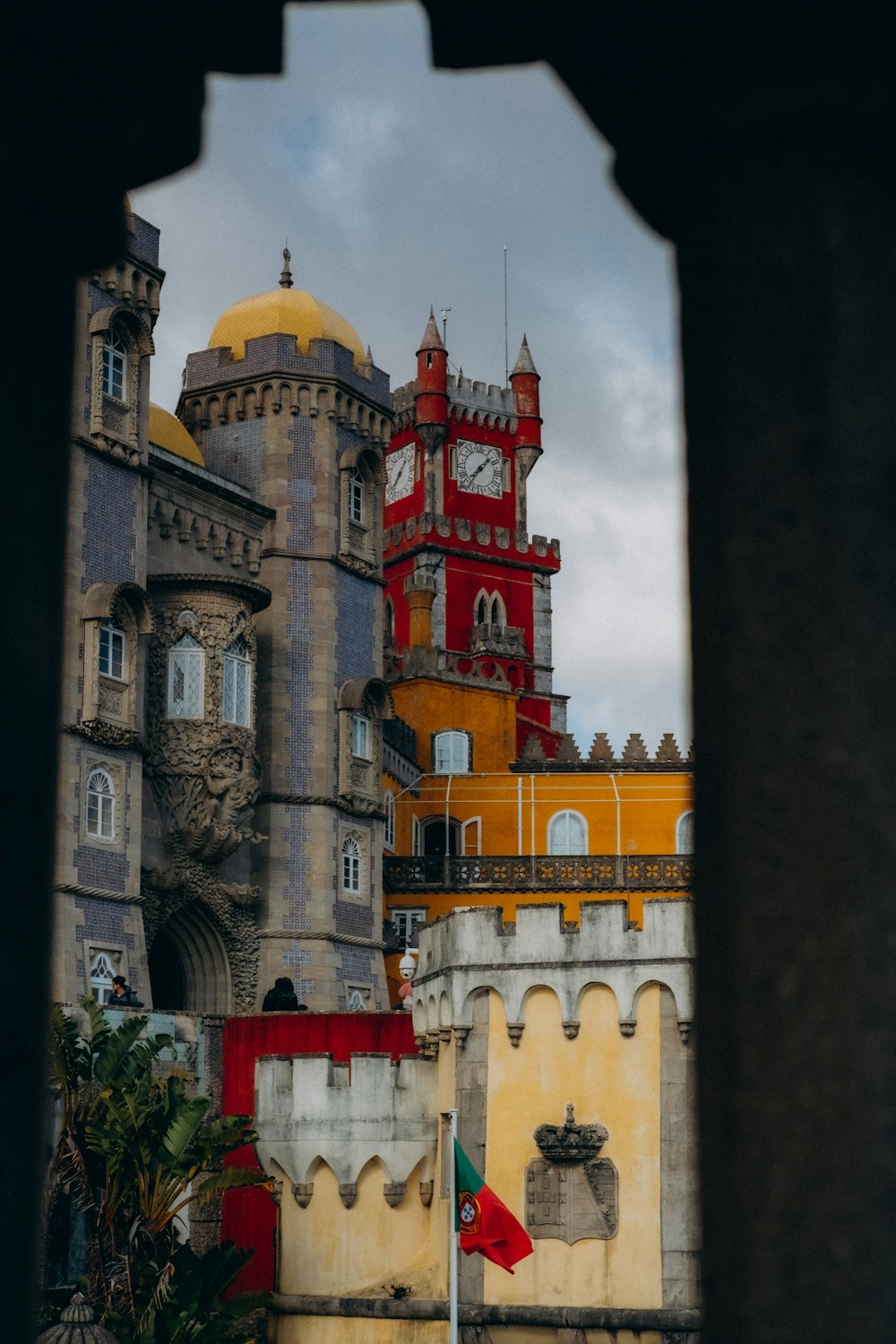 a view of a castle through a hole in a wall